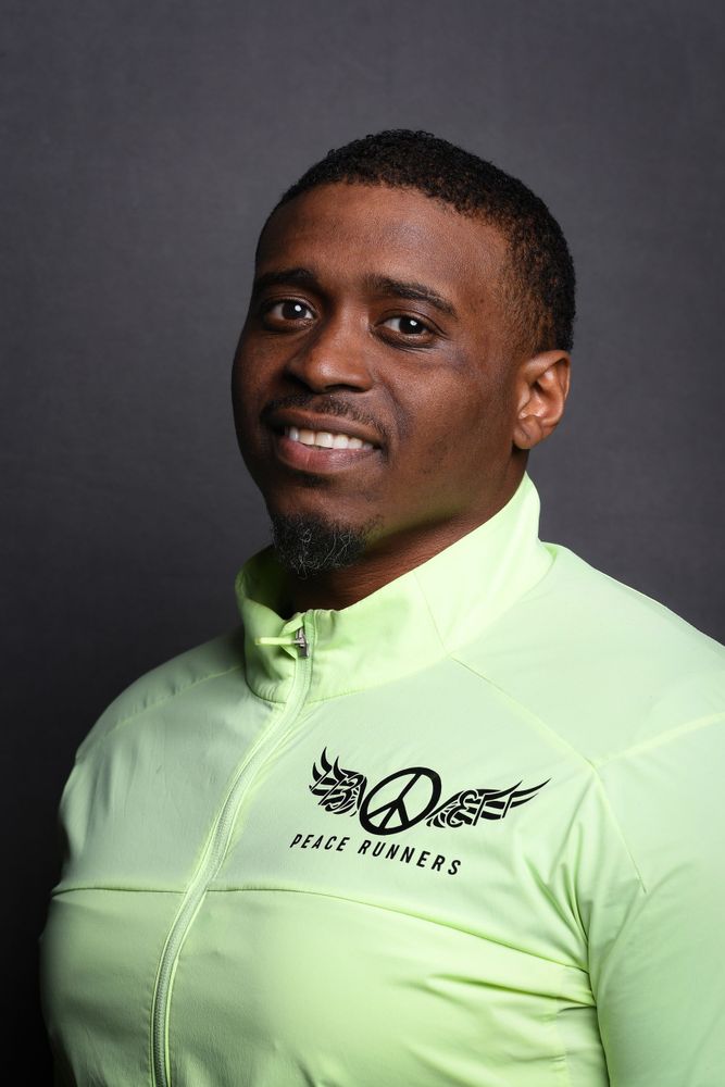 Jackie portrait in Peace Runners jacket
